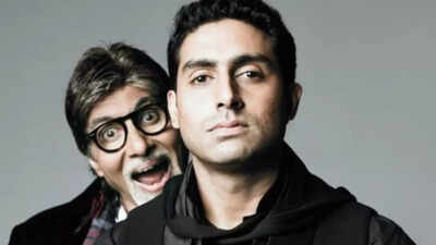 Amitabh Bachchan attentively listens to his son Abhishek during a studio session