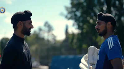 Harpreet Brar and Arshdeep Singh share a light moment during net practice.