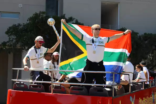 Marco Jansen mans the mace while Corbin Bosch flies the flag during South Africa's bus tour in Cape Town on Friday